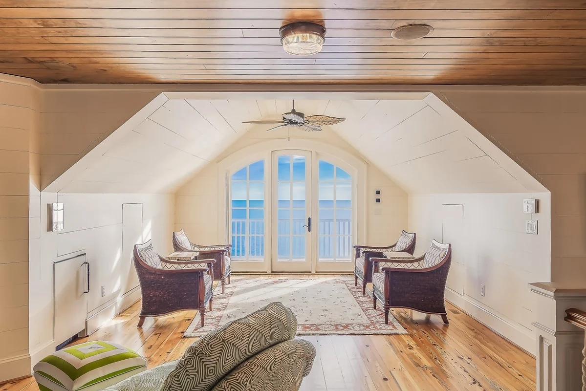 Аttic with armchairs on a wooden floor
